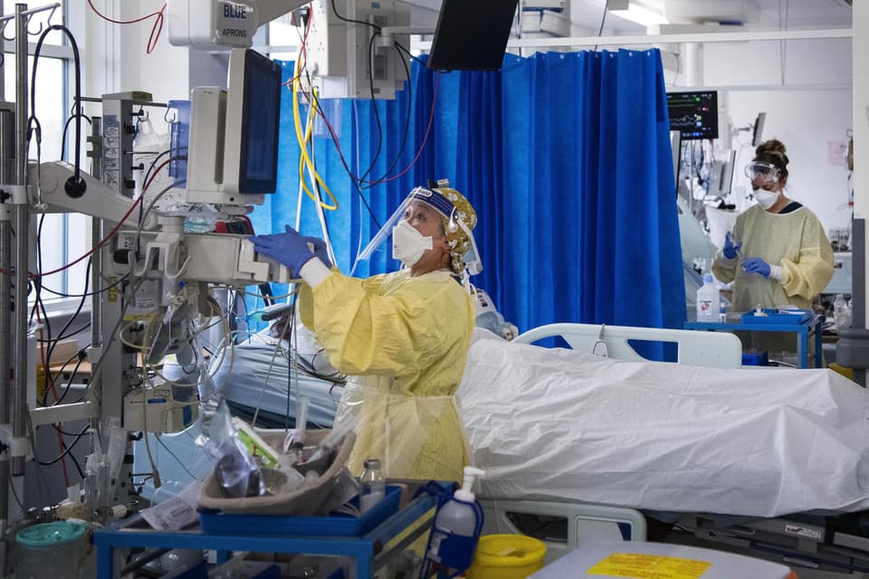 EMBARGOED TO 23:30 THURSDAY JULY 15 File photo dated 07/01/21 of nurses caring for Covid-19 patients in the Intensive Care Unit (ICU) in St George's Hospital in Tooting, south-west London. Half of the coronavirus patients admitted to hospital during the first wave developed at least one complication, new research has found. Issue date: Thursday July 15, 2021.